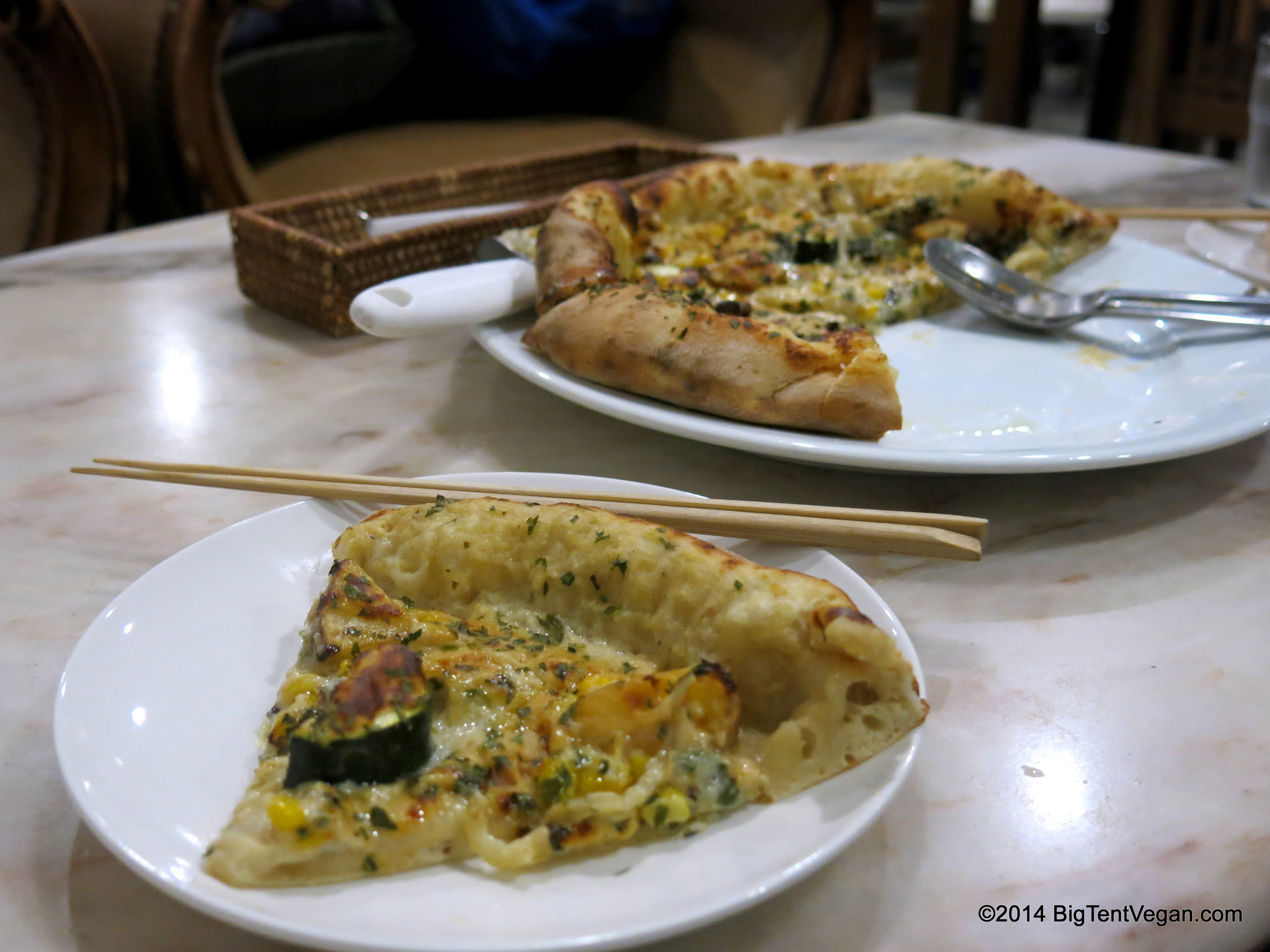 Vegan White Pizza with Grilled Squash and Roasted Potatoes from Vegans
12.00
Café and Restaurant (100% vegan restaurant and grocery store) in Kyoto, Japan. I don't know why we have chopsticks and spoons in this pic...we ate this pizza with our hands as pizza should be eaten!