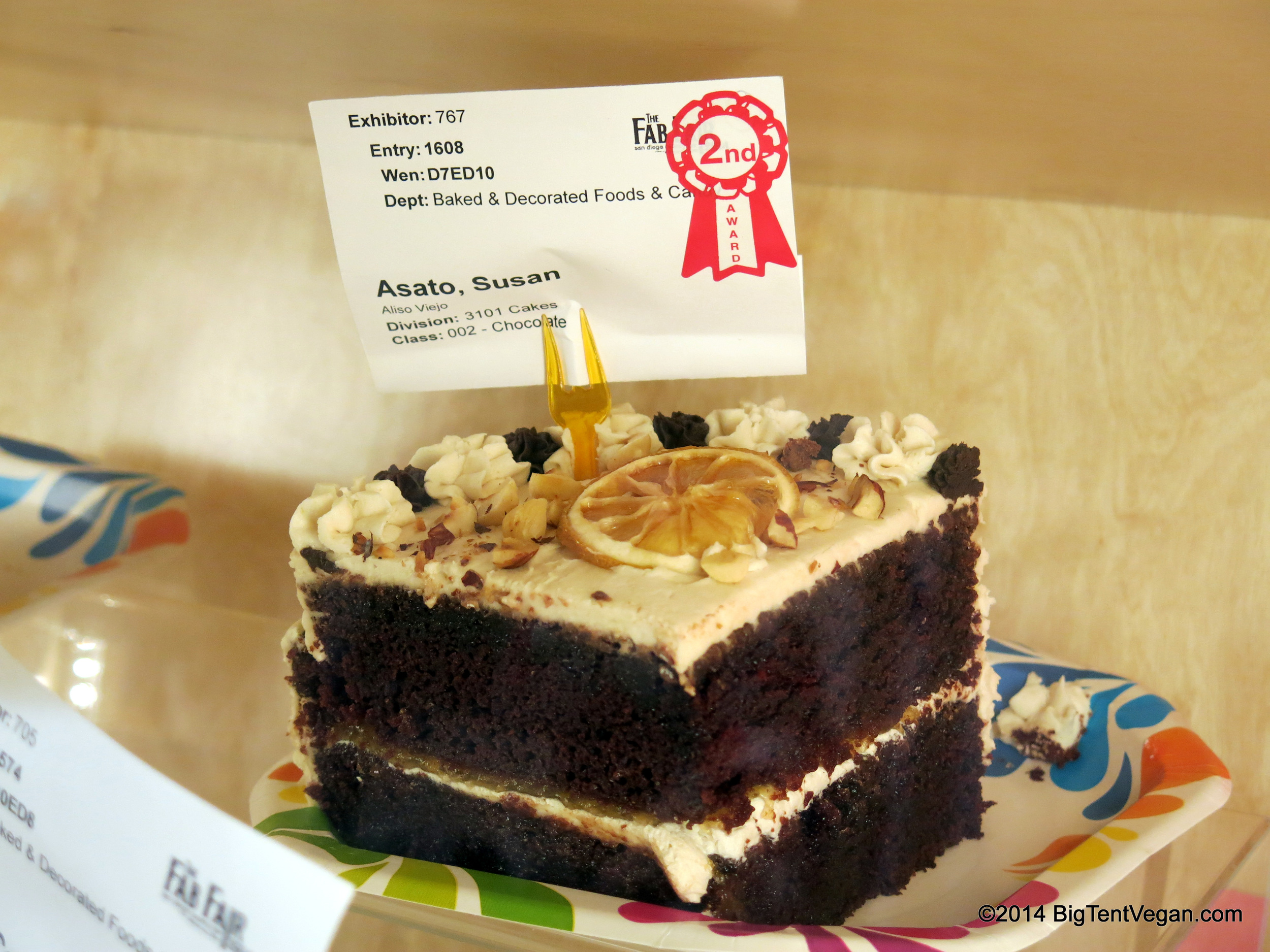Vegan Chocolate Hazelnut Cake with Lemon Frosting. 2nd Place, 2014 San Diego County Fair. Not the best picture of this in the display case -- take my word for it, it looks better fresh. The cake was two weeks old at that point -- they spray it with some sort of sealant or something, I think...