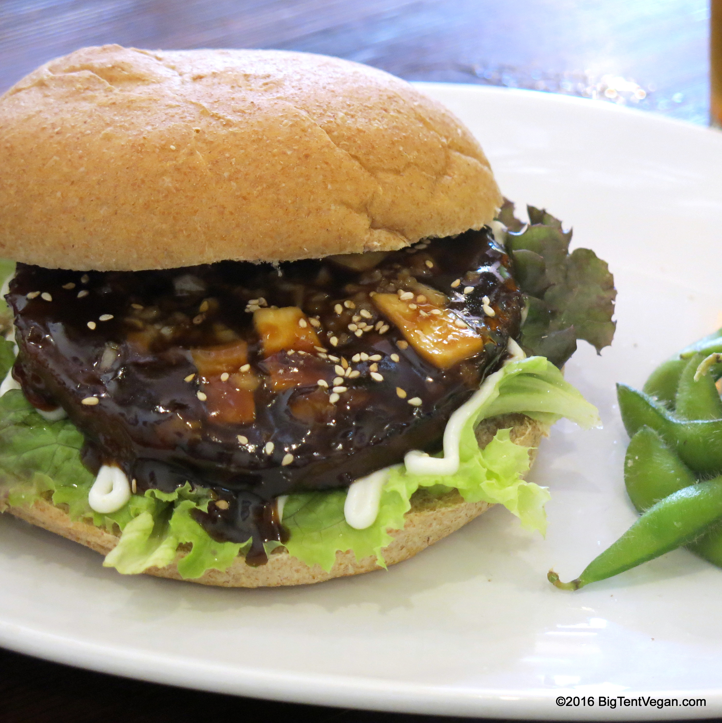 Grilled Meatless Teriyaki Burger with Ginger Teriyaki Sauce, Minced Onion, Eryngii Mushroom Slices, Red Leaf Lettuce, Vegenaise, and Sesame Seeds...so GOOD!