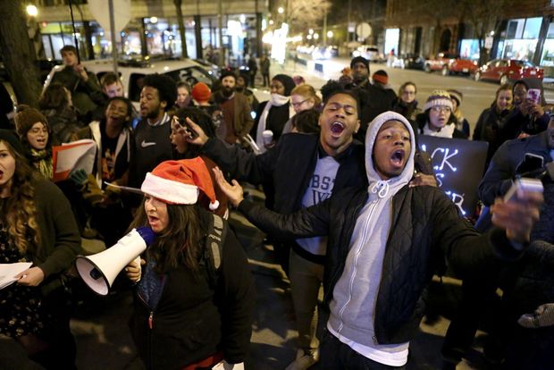 Deray McKesson leads the carollers in a rendition of "Silent Night" er, "Trampled Rights." 