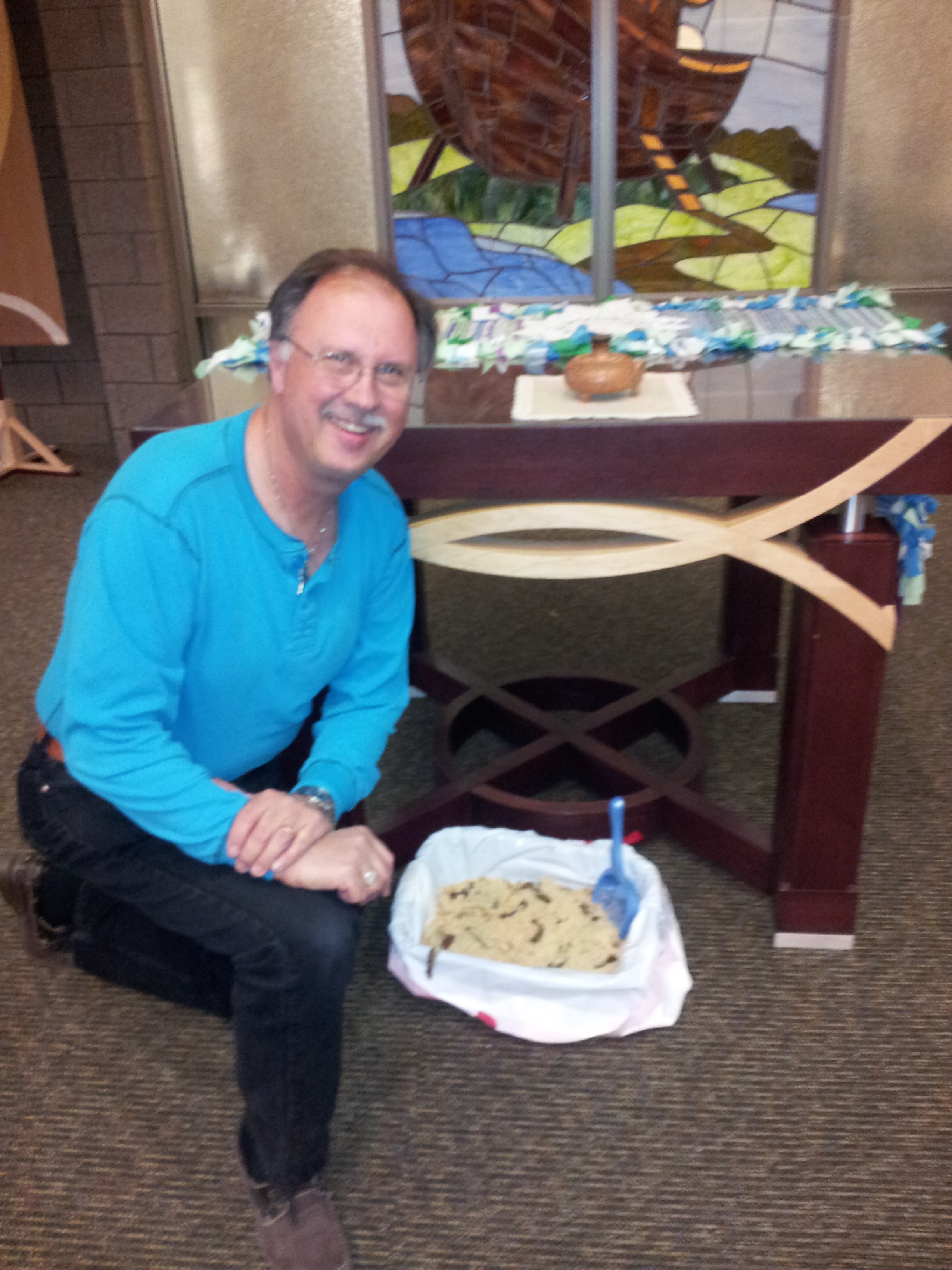 Pastor Dennis, Bremwood's chaplain, posing with my April Fools offering, in the Bremwood Chapel.