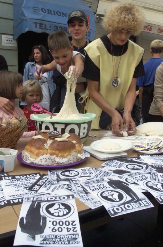 Serbian children play with flour during a protest action entitled “Let’s spice up the food,” meant to bring awareness of the importance of Yugoslav national elections in September 2000 in Belgrade. Photo by Darko Vojinovic/Associated Press.