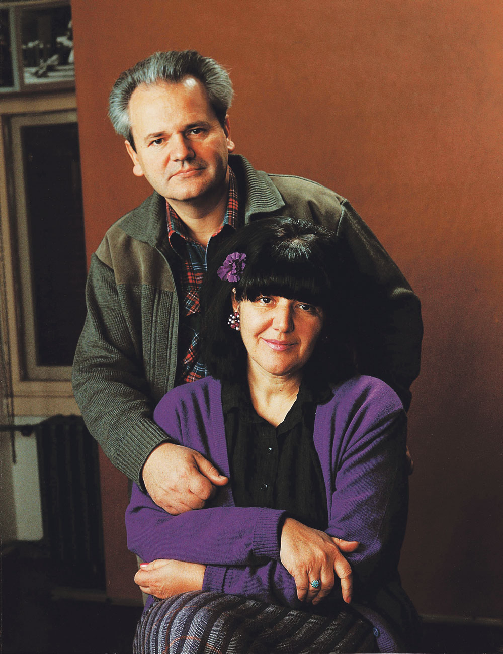 What a pair! She's the strong-fisted head of the for-all-intents-and-purposes sole political party in Serbia ( JUL ), and he's charged with genocide and crimes against humanity.