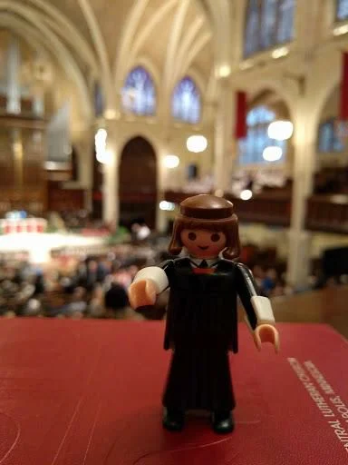 My friend Rev. Bonnie Wilcox featured her Luther doll in a variety of arresting locales and posted them on FB. Here he's getting ready to preach (NOT in Latin!)