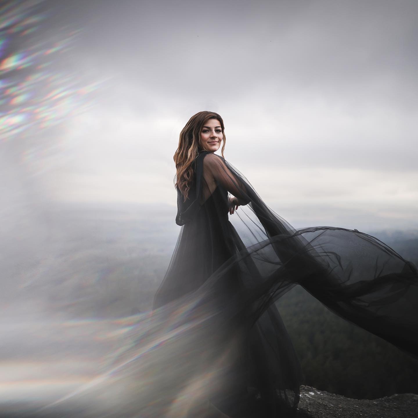 A photo of Jessica on a little mountain top. Jessica is a &ldquo;sound healer&rdquo;, she uses instruments to guide people through her journeys, like the picture, blending the music from one instrument to another. She uses breath, yoga and energetic 