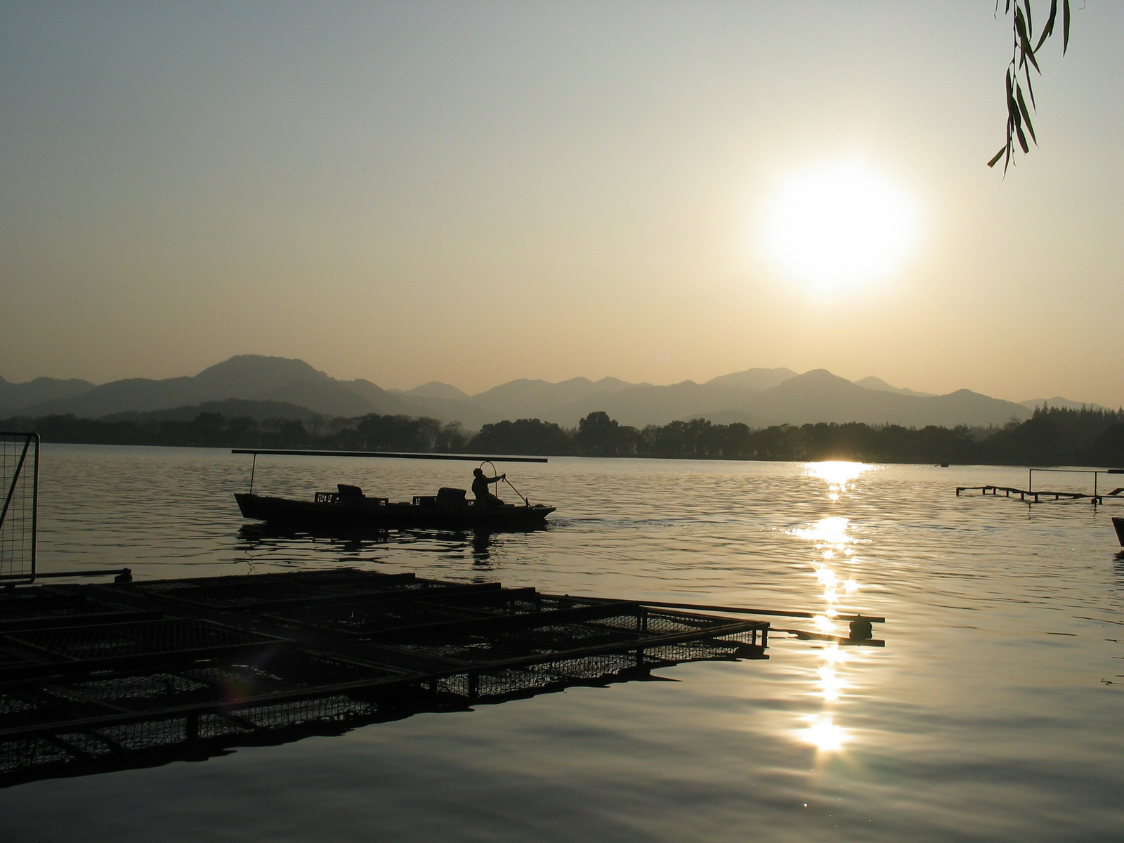 Hangzhou, China (2004) - Boats on West Lake at sunset.
