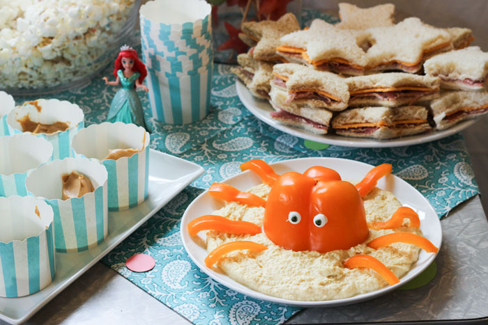 Hummus with octopus (originally via Better Homes and Gardens but found here ), peanut butter cups for "fishing" , and star shaped ham and cheese sandwiches.