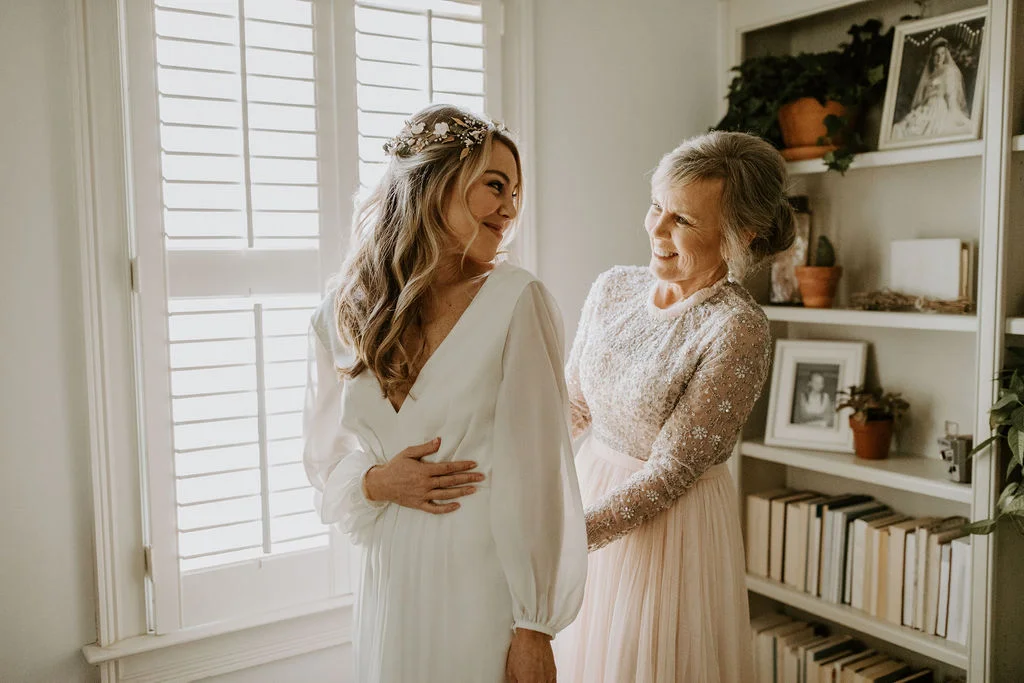 My grandmother & my mama wore the same dress on their wedding day. I chose to add buttons from their gown to my own as my way of keeping a peice of their dress with me on my own wedding day.