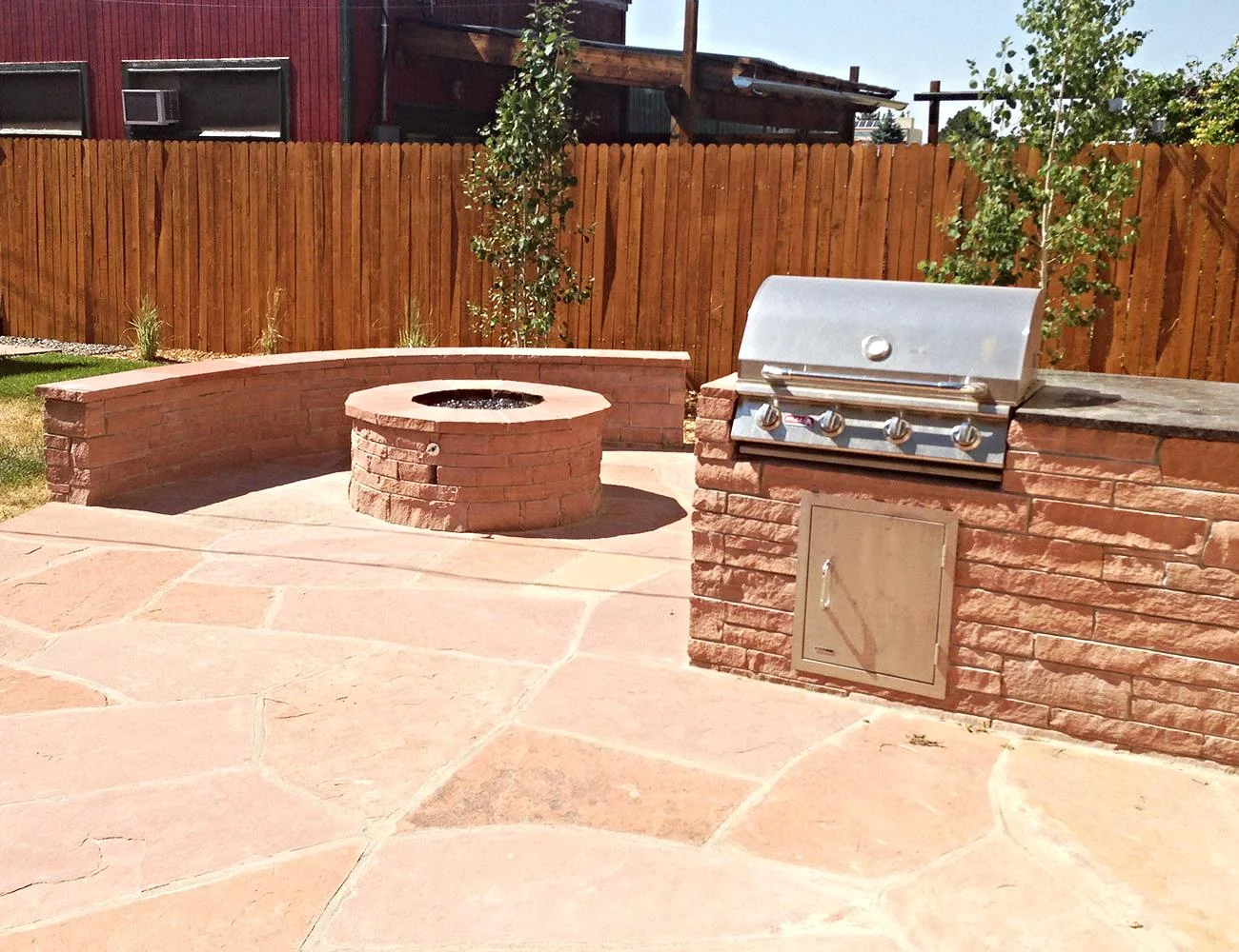 Red Flagstone Firepit & BBQ combo with Sitting Wall.