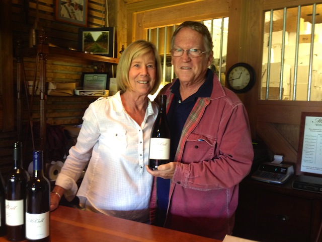 Photo by Rachel Young | Russ McCall, right, with his wife, Nicola Plimpton, holds a bottle of 2010 Pinot Noir Reserve.