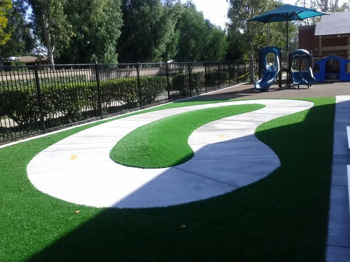 The tricycle track and play structure on the toddler playground