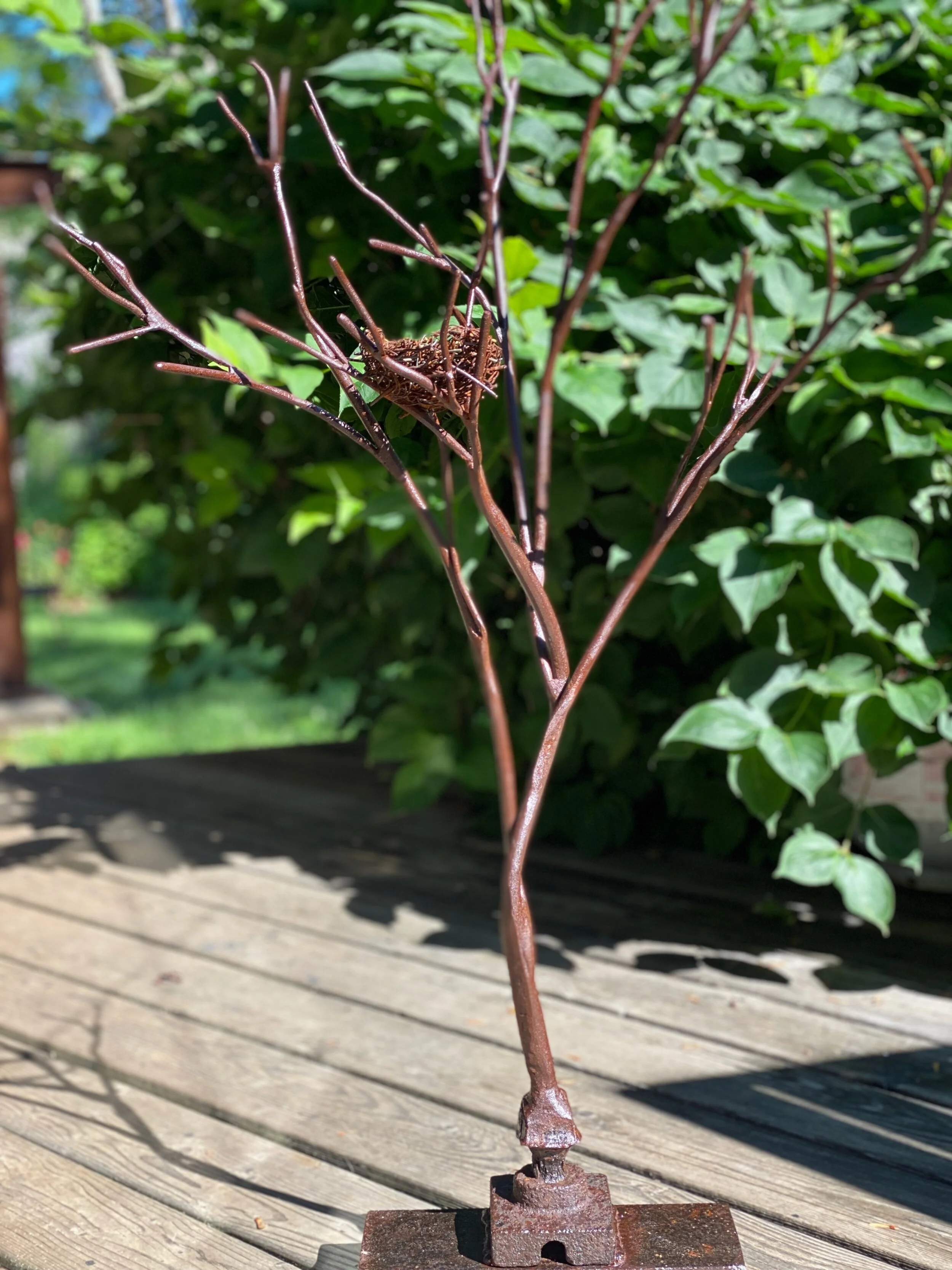 Small tree on steel stand