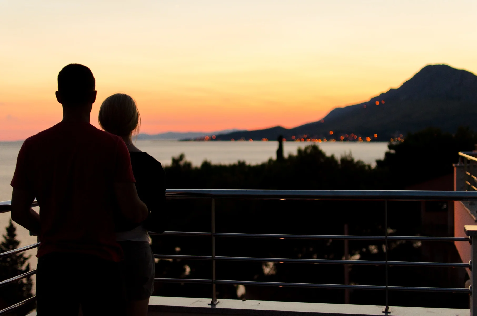 COUPLE STANDING PEACEFULLY SUNSET.jpg