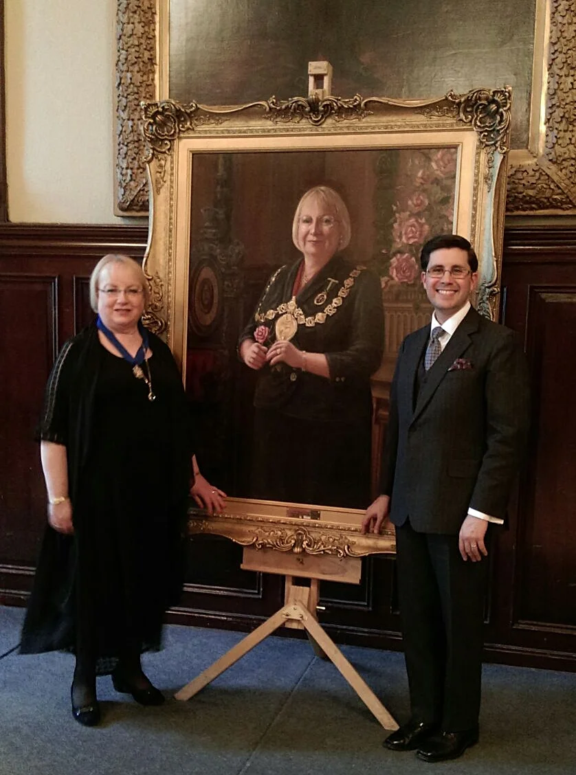 The painting flanked by sitter and artist.
