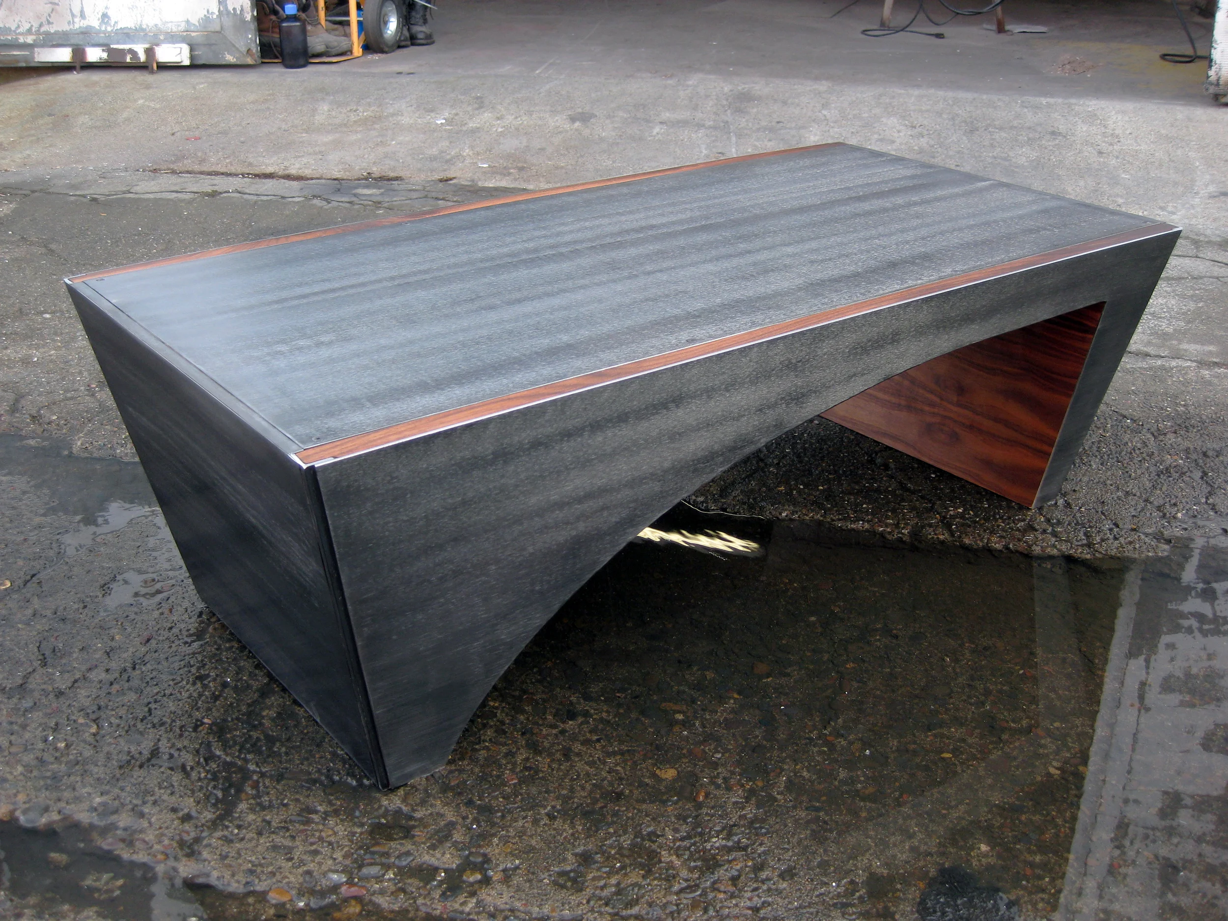 Custom Steel Slope Coffee Table Shown with walnut inlays.