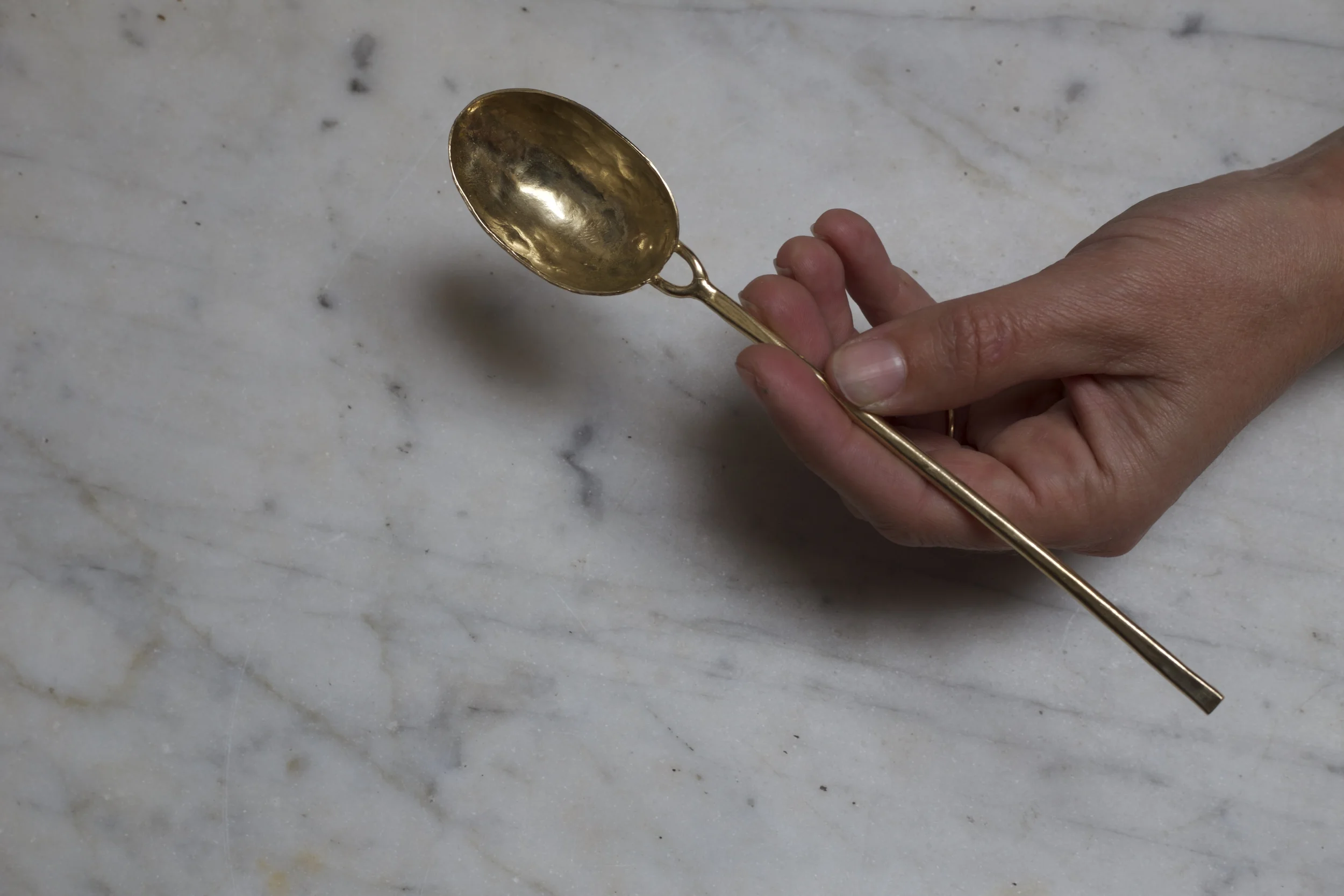 forged soup spoon, bronze