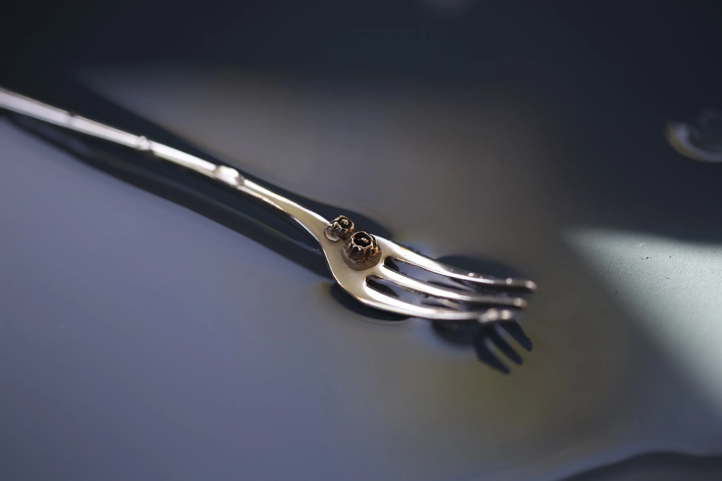 sterling seafood fork with bronze barnacles