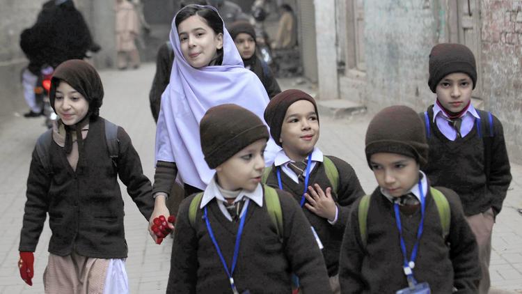 In Peshawar, Pakistan, students leave the Army Public School on its first day after reopening; the school was attacked by Taliban militants in December, killing 133 students and 16 staff members. (Bilawal Arbab / European Pressphoto) - By KIRAN NAZISH
