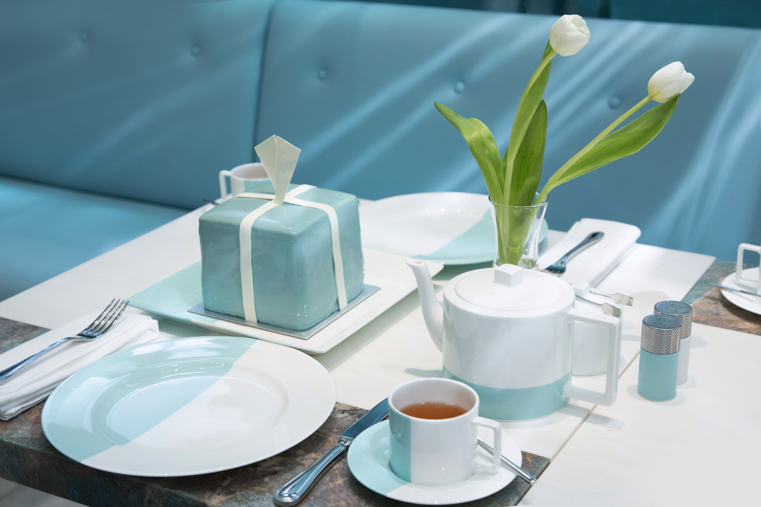  From premium tea to tantalizing dishes, everything will be served with the iconic Color Block tableware designed by Tiffany &amp; Co., an artistic bone china and silver collection that stands out with a bold palette of white and Tiffany Blue. 