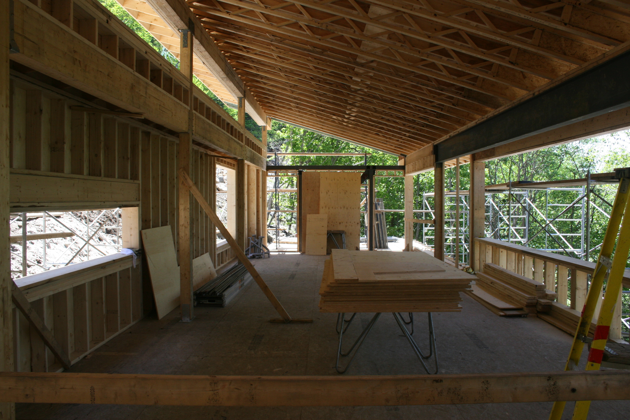 Kitchen and living room with exterior deck beyond