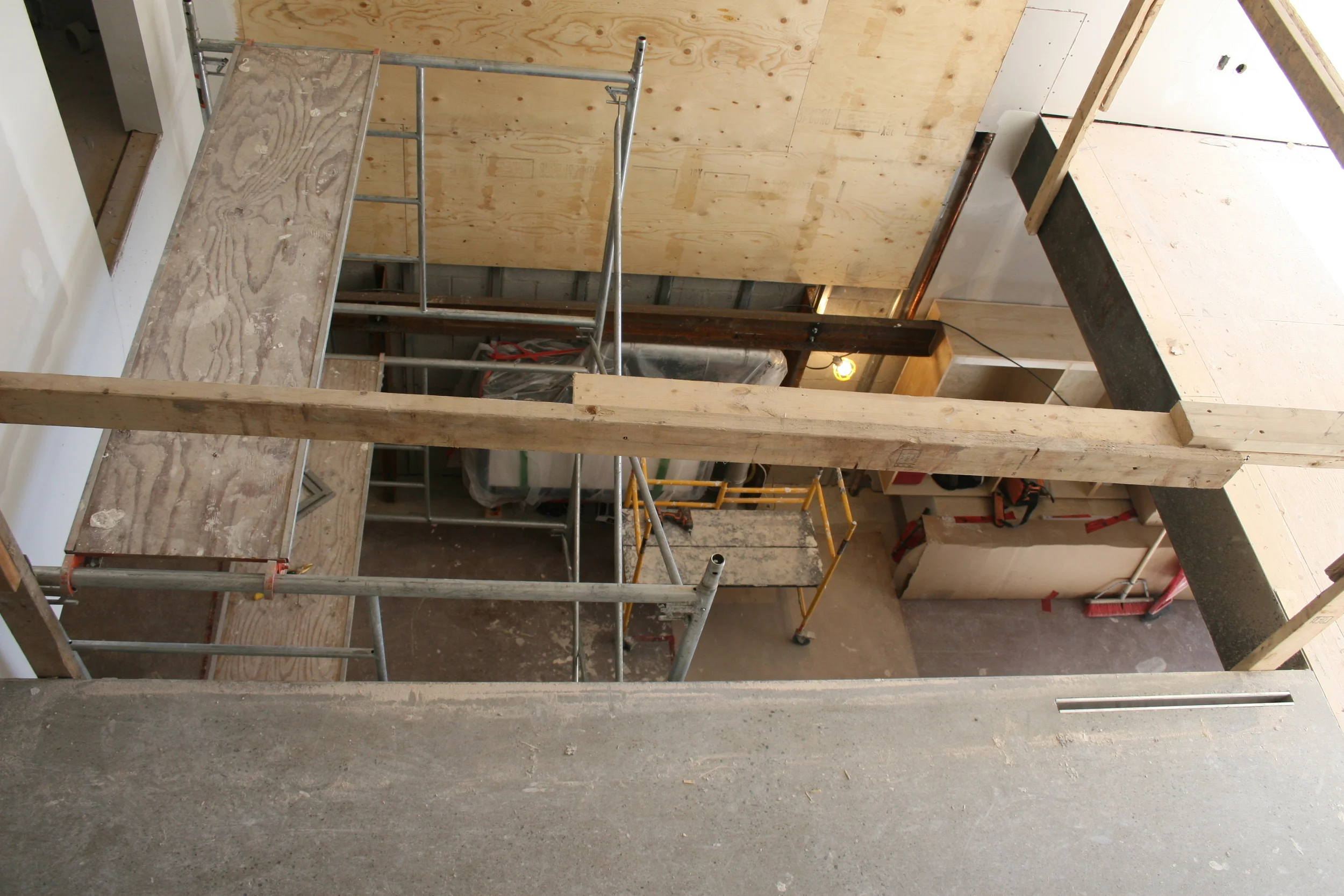 Looking into dining room and kitchen from 2nd floor bridge
