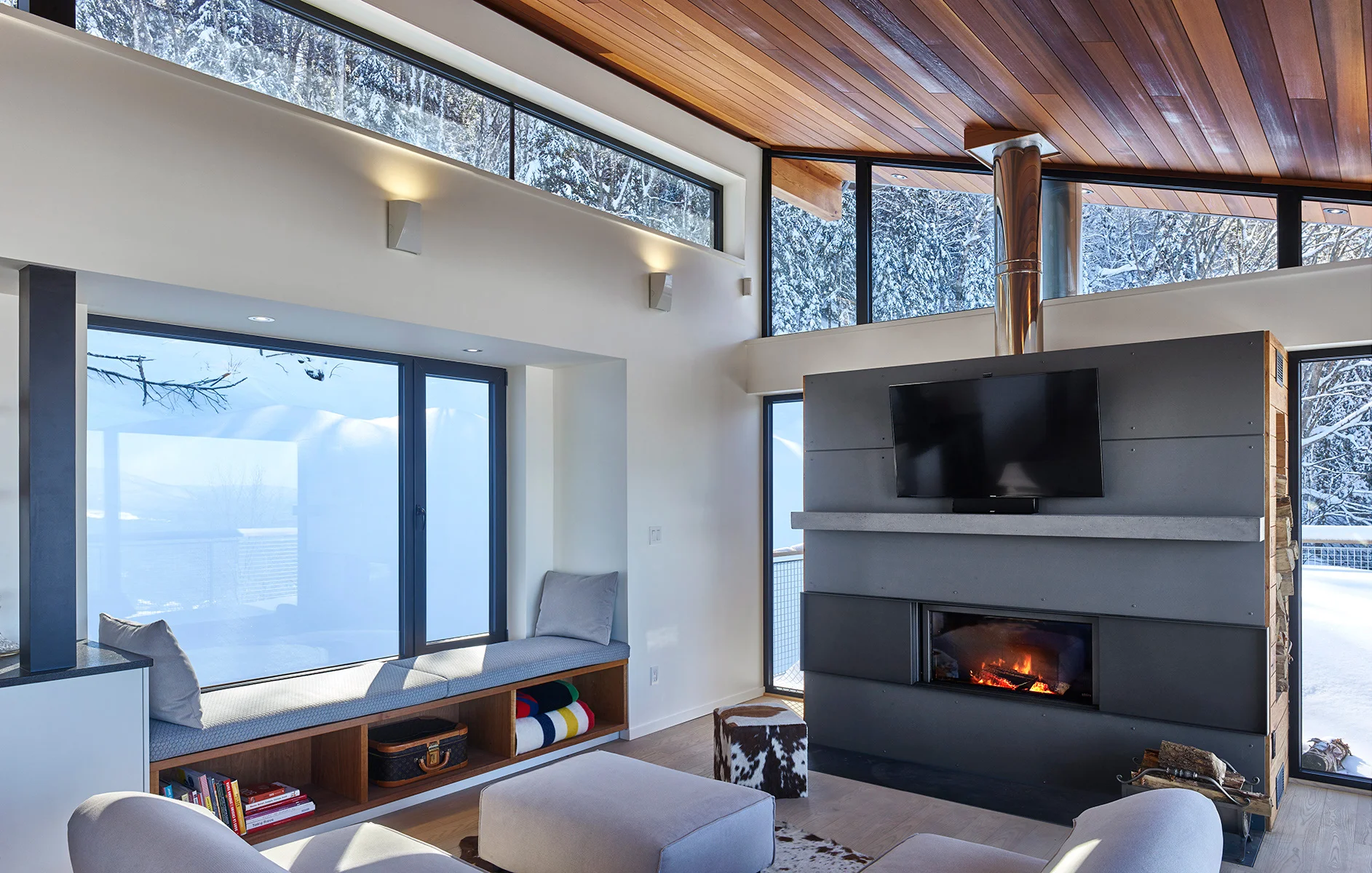 ROBITAILLECURTIS-Chalet-Interior-LivingRoom-Fireplace-Stuv-WindowSeat.jpg