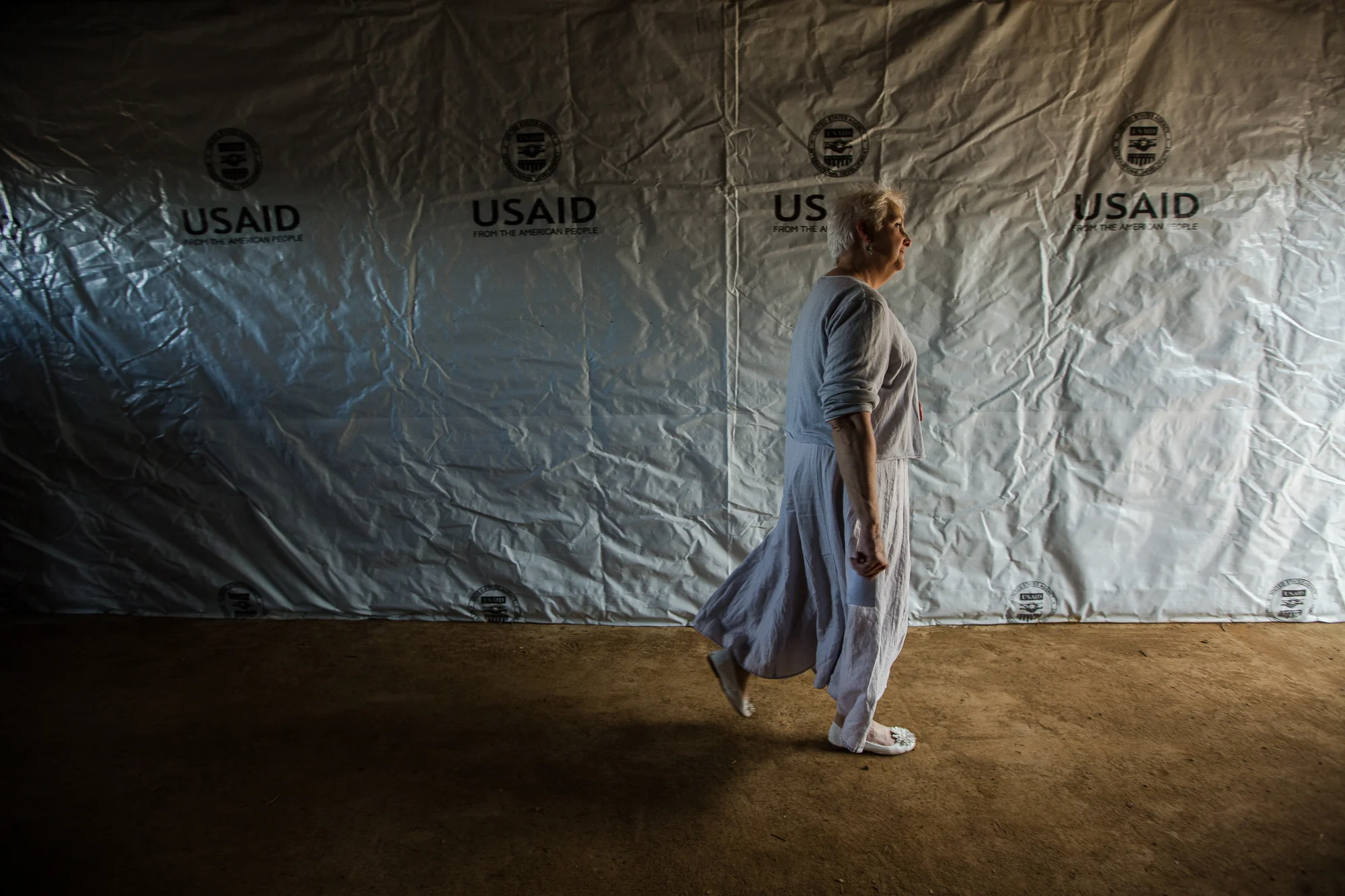  Monrovia, Liberia - October 1, 2014: &nbsp;U.S. Ambassador to Liberia, Deborah R. Malac, walks through what became a visiting area for families of Ebola patients inside an Ebola treatment unit build with funding from USAID on the former Ministry of 