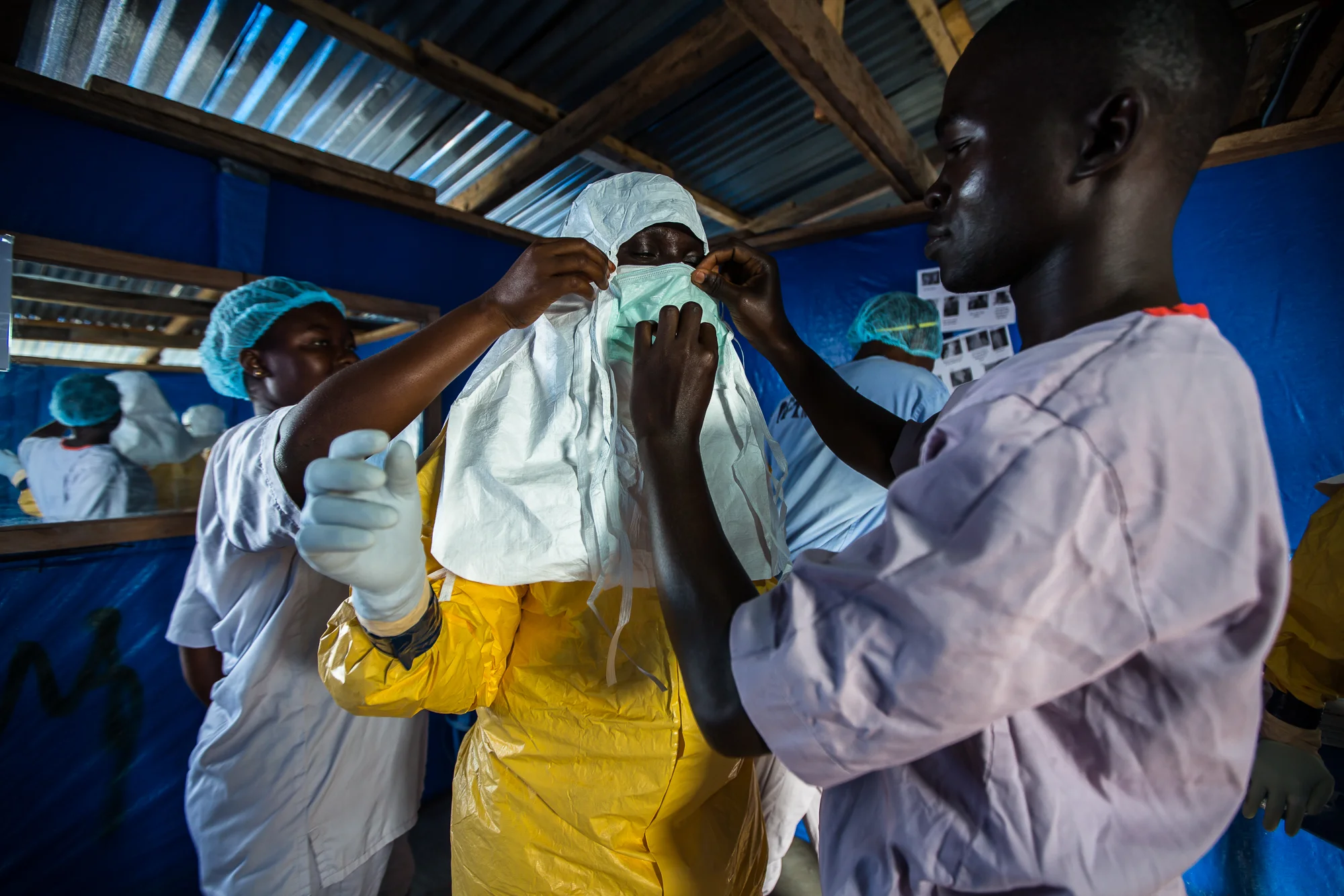  Suakoko, Bong County, Liberia - October 9, 2014: Felicia, a 29 year old Liberian nurse, prepares to go inside the Ebola patient ward&nbsp;to draw blood from confirmed patients. The samples are sent to the U.S. Navy Mobile lab for testing. If a patie