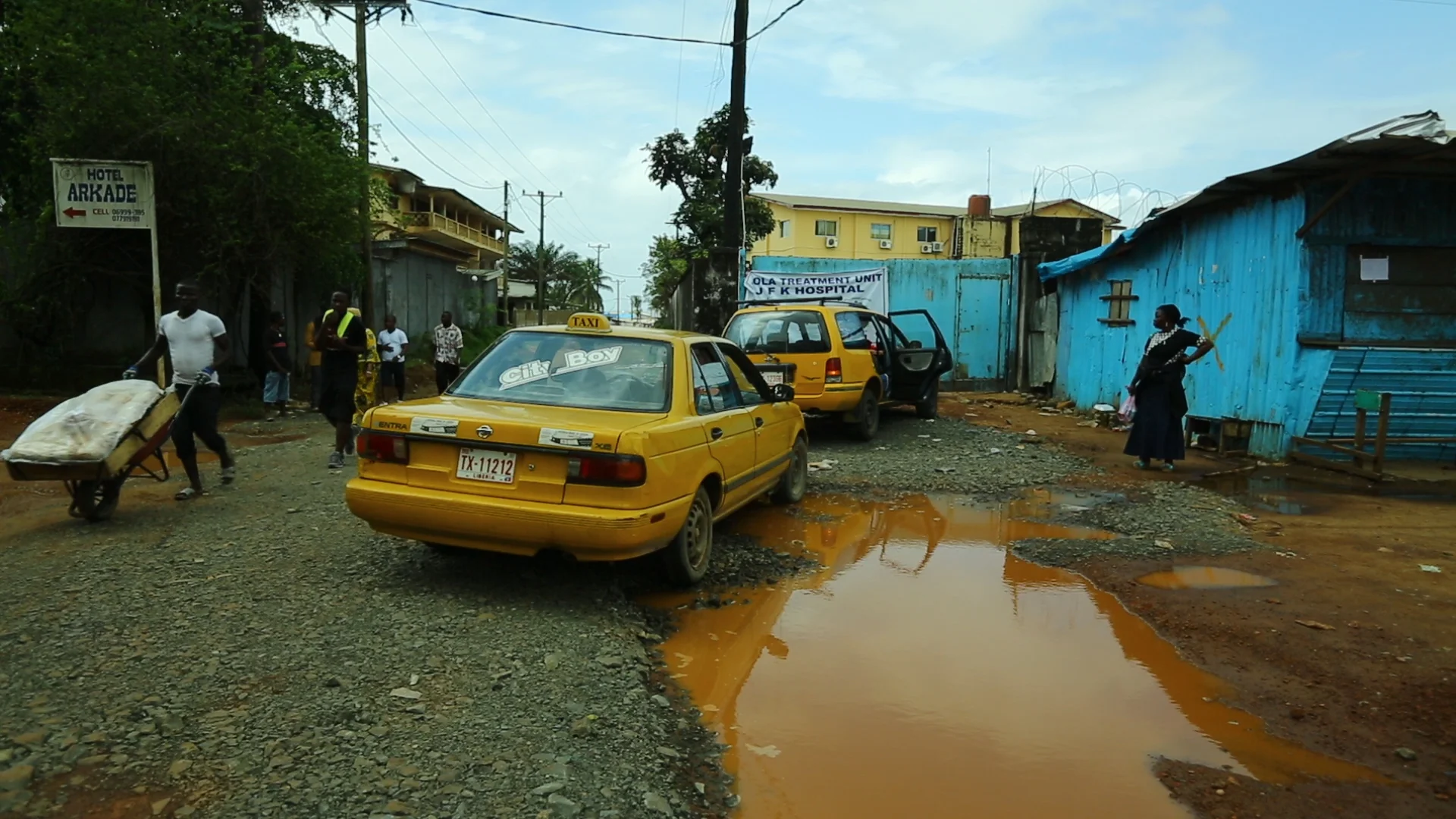  Monrovia, Liberia - Sept 15, 2014: &nbsp;Taxi cabs carrying&nbsp;Ebola patients wait outside the JFK Hospital Ebola treatment unit.&nbsp;&nbsp;Photo by Morgana Wingard 