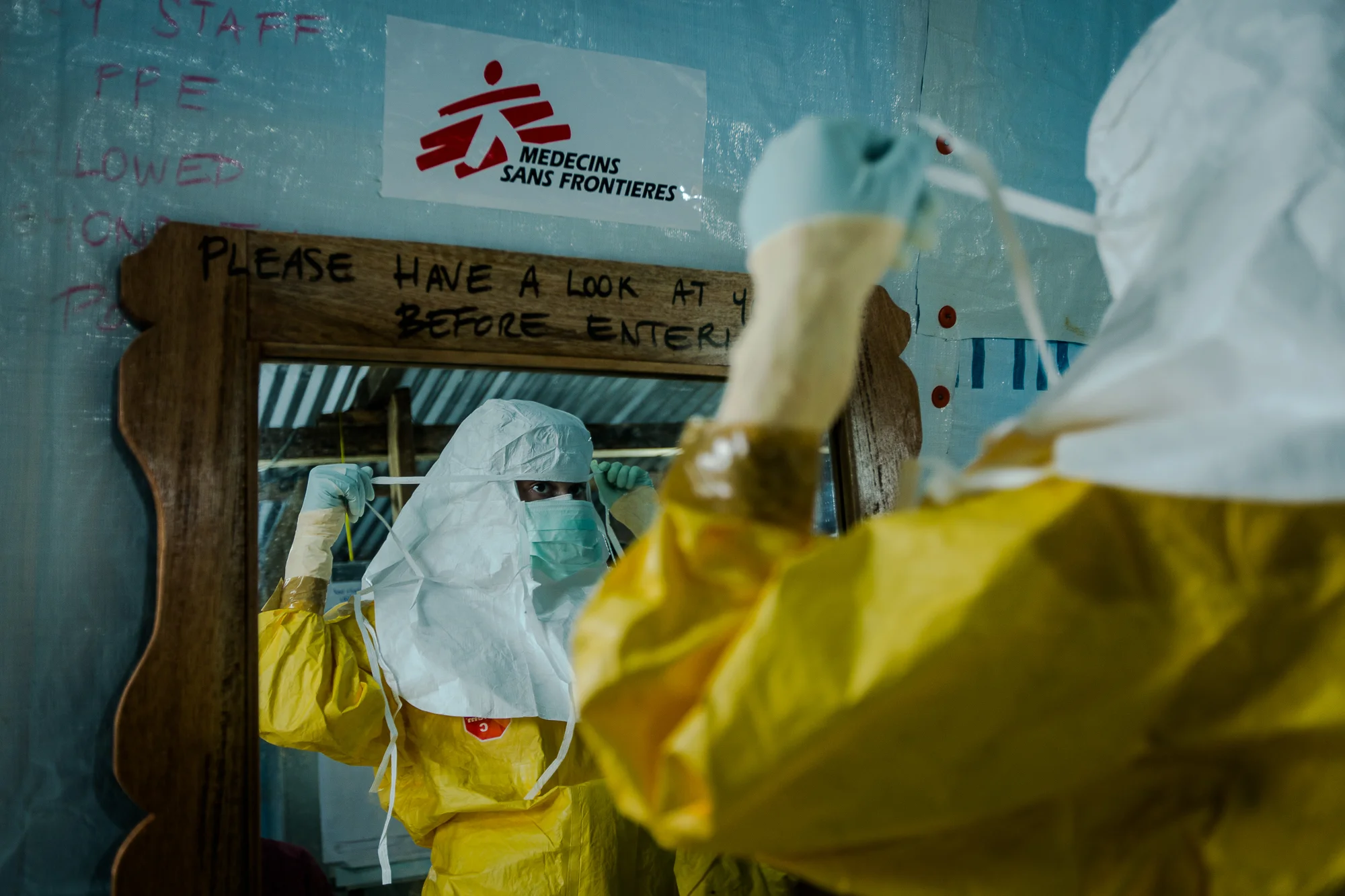  Monrovia, Liberia - Aug 30, 2014: &nbsp;All healthcare workers must wear full Personal Protective Equipment (PPE) before they cross over into the hot zone&nbsp;or patient area at ELWA 3—the main Ebola treatment unit run by Doctors Without Borders (M