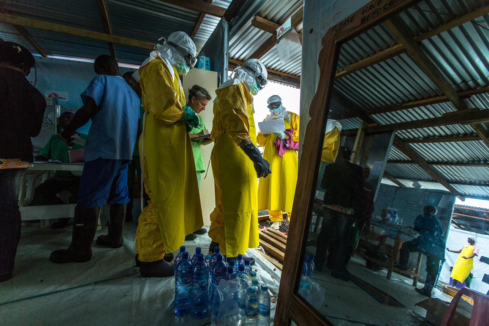  Monrovia, Liberia - Aug 30, 2014: &nbsp;Noah, a hygenist, suited up in his Personal Protective Equipment (PPE) enters the hot zone for the first time at ELWA 3. Only staff dressed in PPE&nbsp;are allowed past this point and nothing that goes in can 