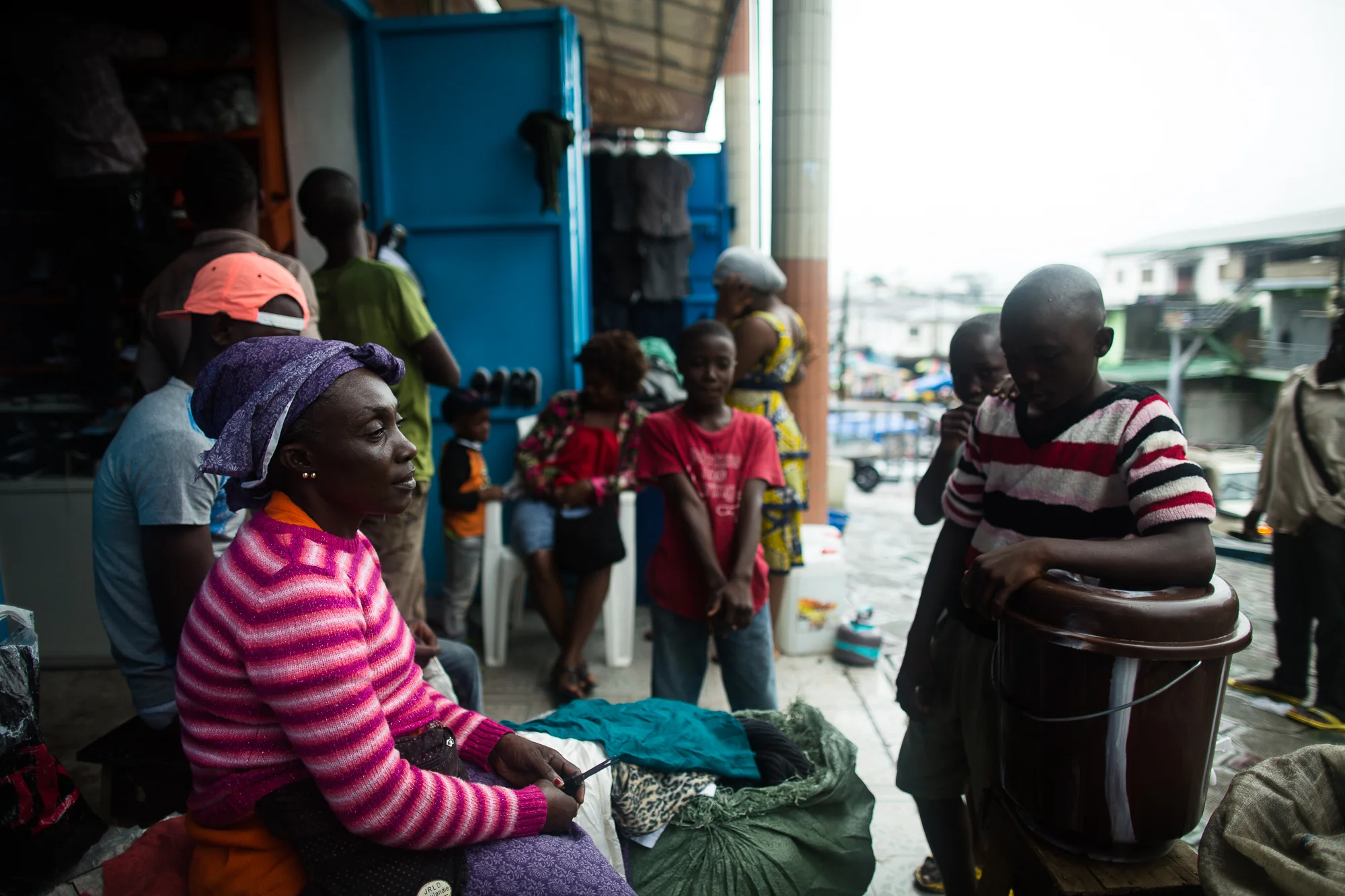  Monrovia, Liberia - September 18, 2014: &nbsp;Anne Benson (49)&nbsp;sells used clothes in Waterside Market to support her 9 children and 5 grandchildren. She lives with her husband and children in Sinkor. Since the Ebola outbreak her sales have plum
