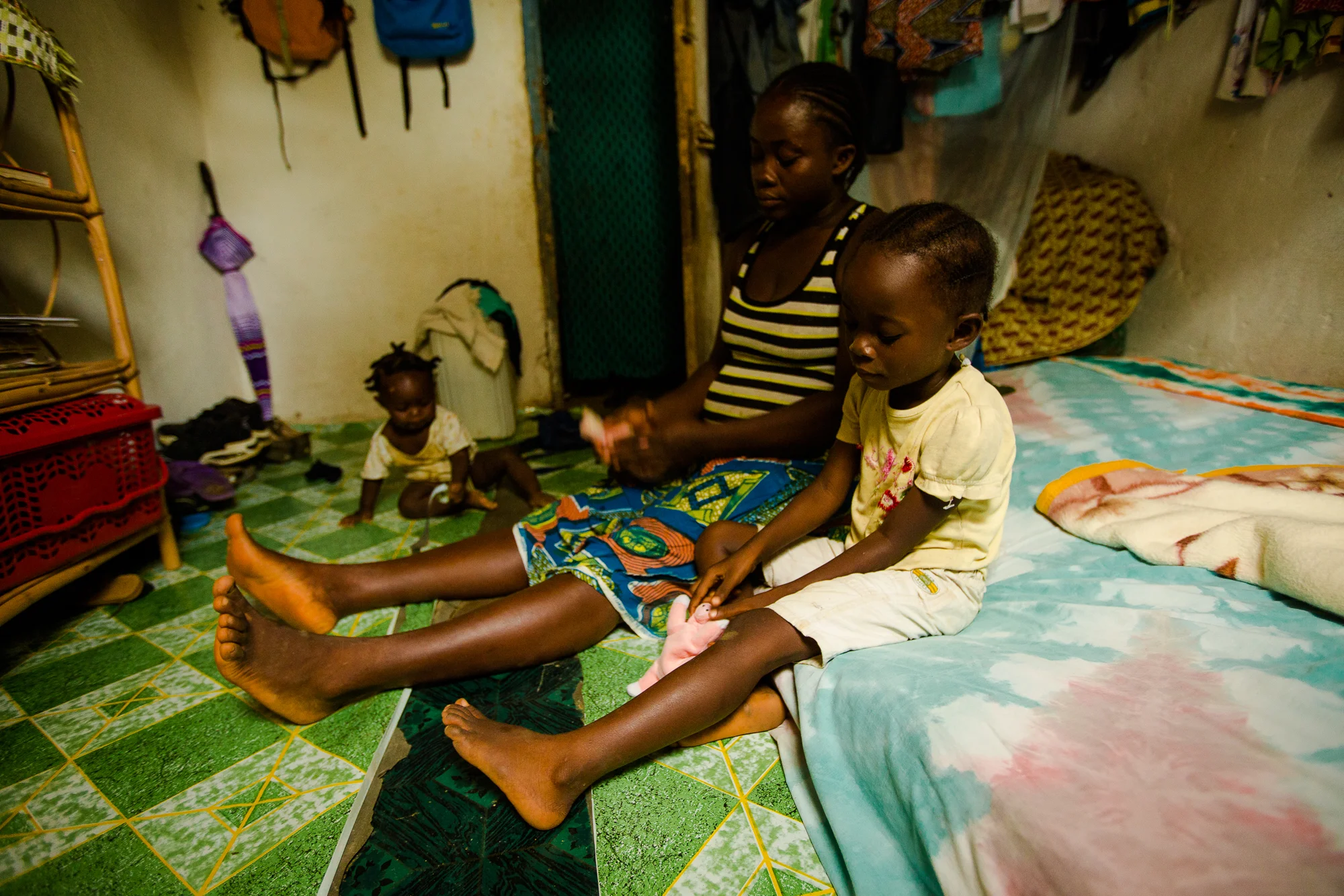  Tubmanburg, Monrovia, Liberia - June 5, 2014: When Blessing was 4 months old, her mother, Bendu, was working on a farm in rural Liberia. One day she forgot something at home and left Blessing with a close friend at the farm. When she returned, Bless