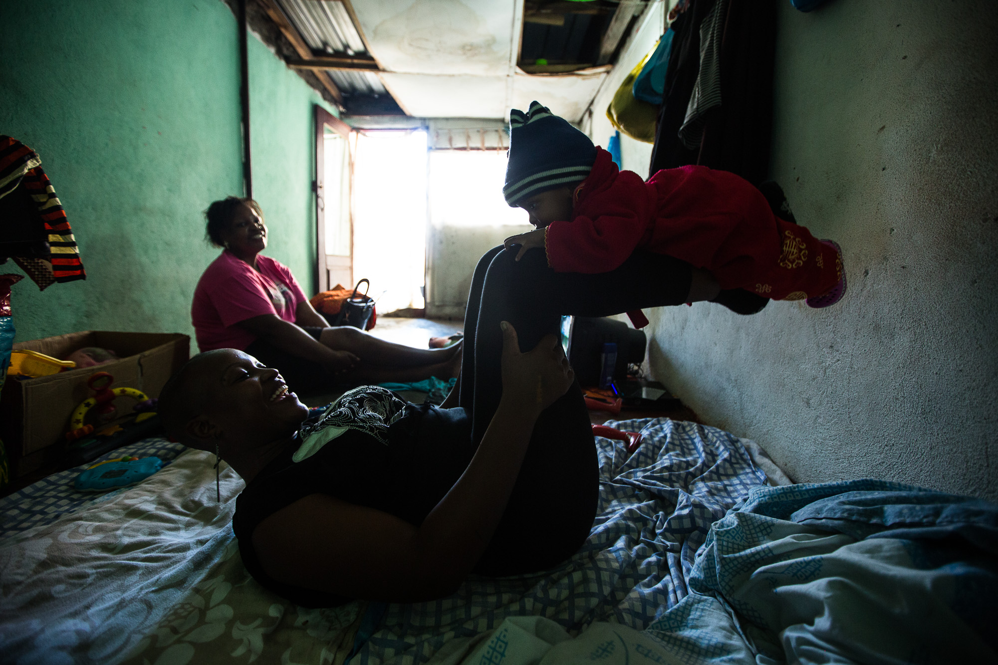 Precious at home in Beira with her one year old son.