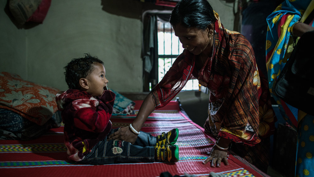  Supriya Dae (mother) and her husband, Rotonu Dey, wake up their son, Ornoy Dey in the morning 