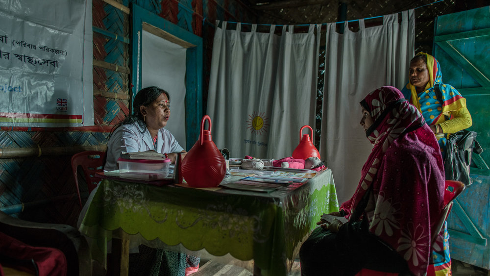  Shanta Das, a paramedic at Smiling Sun Clinic, consults pregnant mothers in a satellite clinic. 