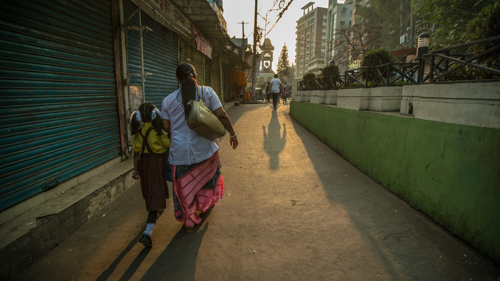  Shanta Das, a paramedic at Smiling Sun Clinic, walks her daughter to school in the morning before going to work. 