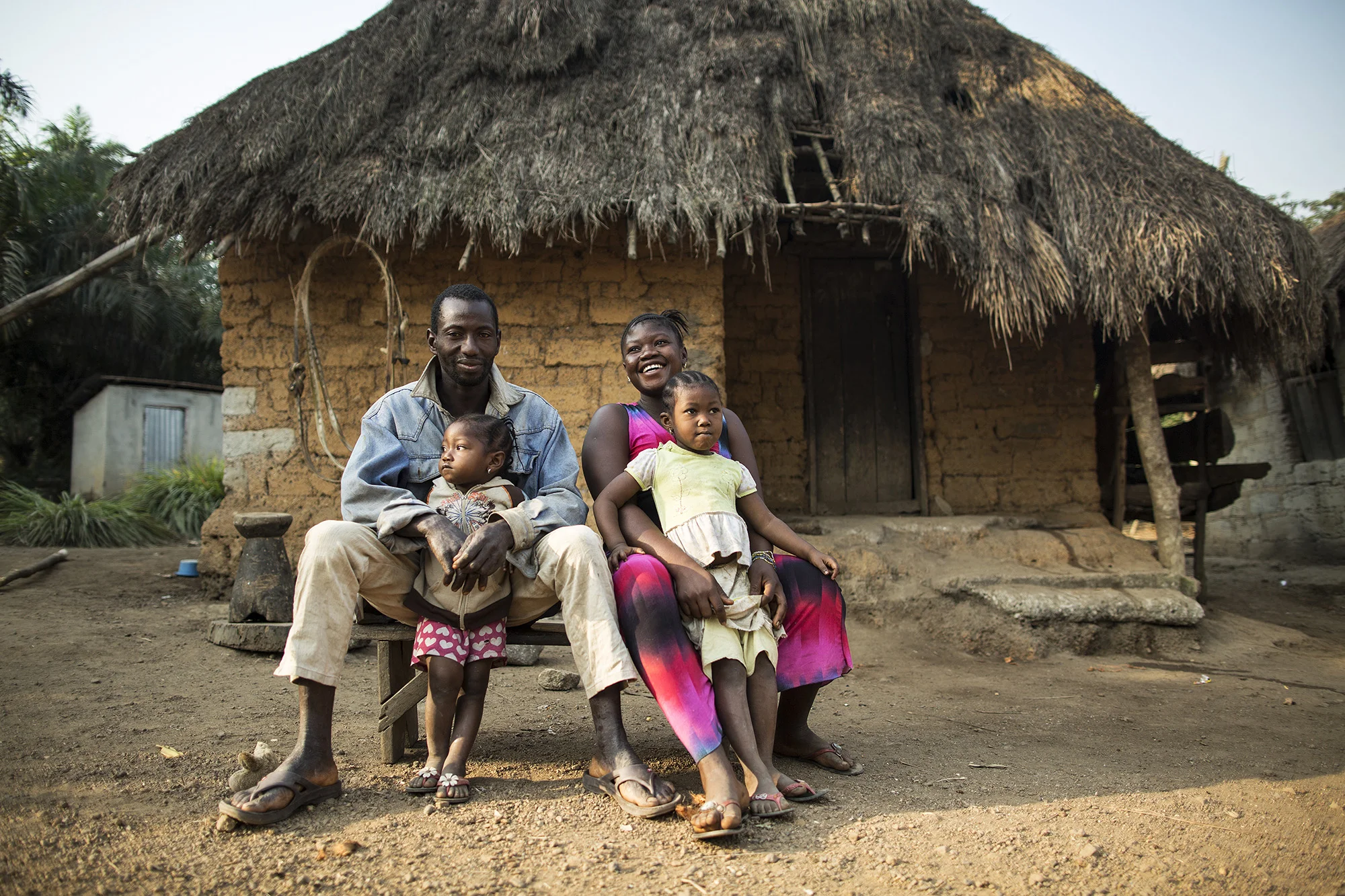  Aminata Kalokoh, top right, of Makai Village, poses for a photo with her daughter, Saley, 5, clockwise from bottom right, her daughter, Marie, 2, and her husband, Kelfar Sesay.&nbsp; 