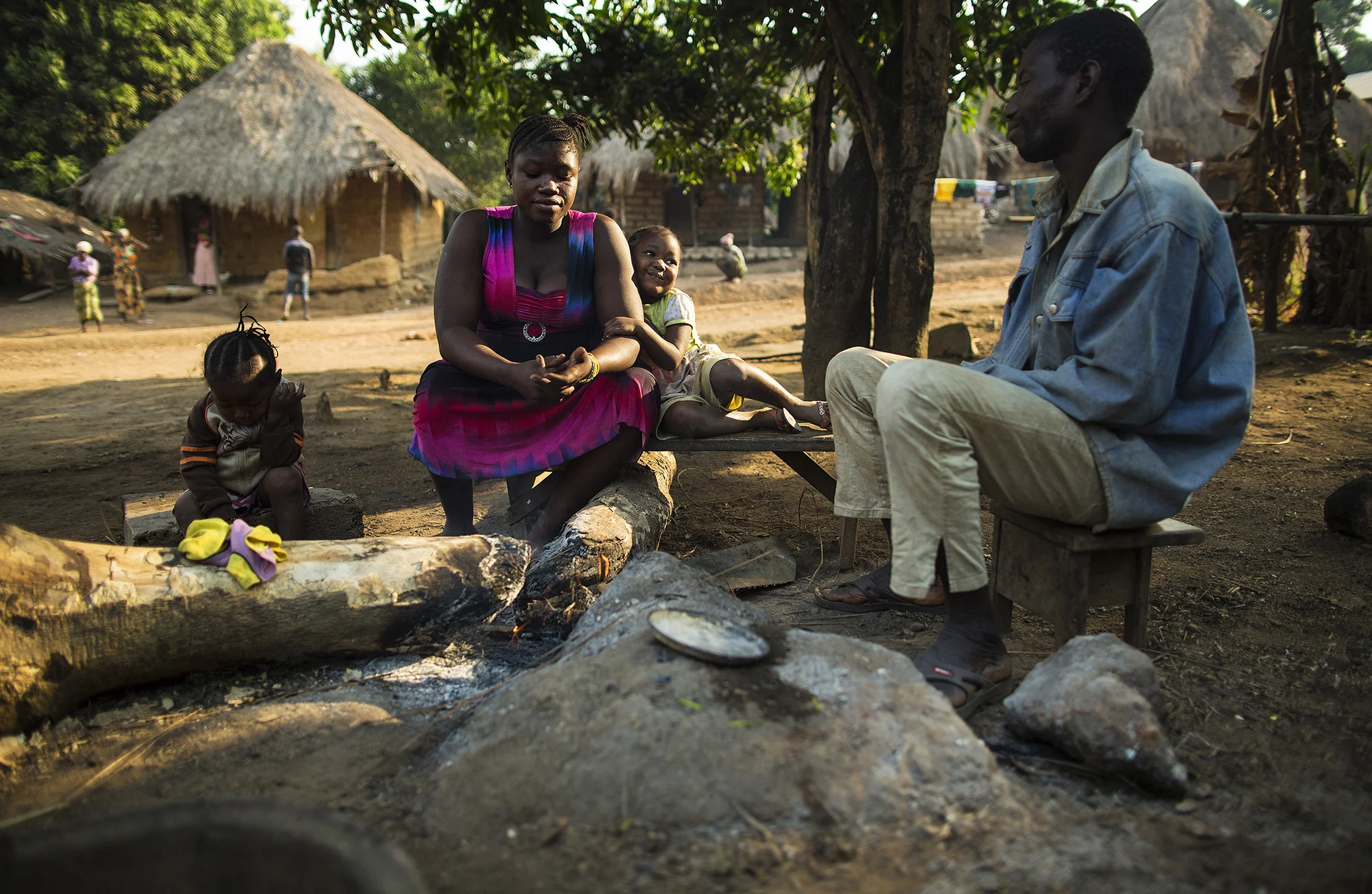 Aminata Kalokoh, second from left, sits with her daughter, Marie