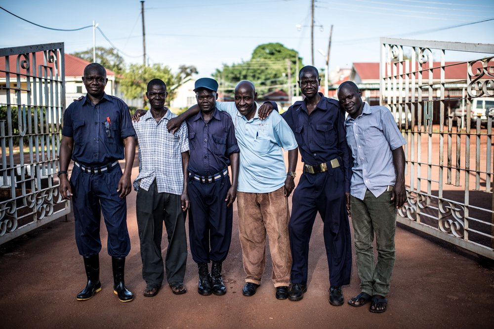  A team of security guards pose for a picture at the entrance to the Jinja Regional Referral Hopsital. 