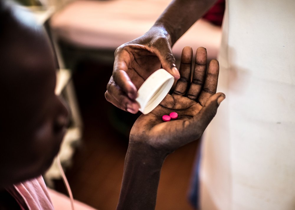  Midwife Lotukei Anna Grace dispenses a patient’s medications in the maternity ward of the Matany hospital in Karamoja, Uganda. 