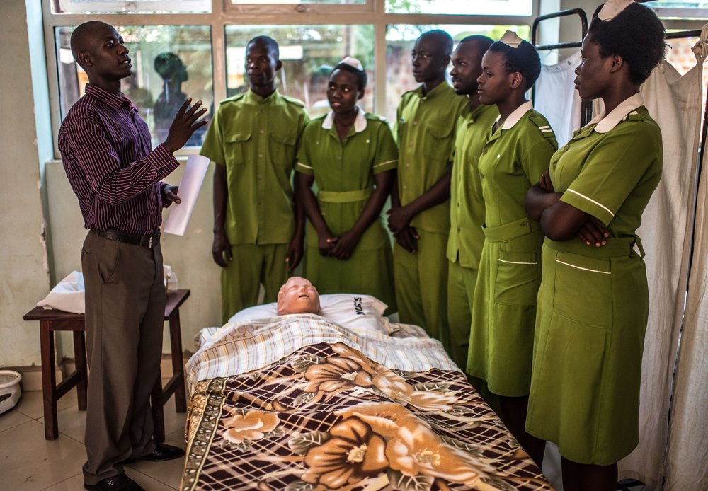  Edweo Sam, 32, a clinical instructor at the Good Samaritan School of Nursing & Midwifery in Lira, Uganda, teaches students how to take a patient’s vital signs. 