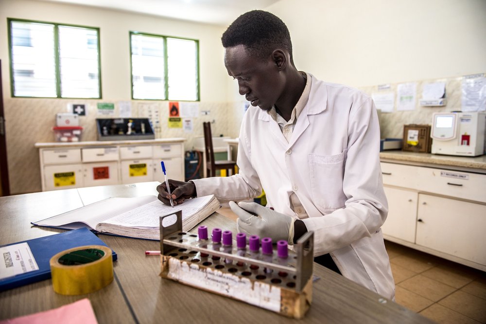  Abraham Atirak, 26, a lab assistant at the Matany hospital in Karamoja, Uganda, tests blood samples to ascertain the blood group. 