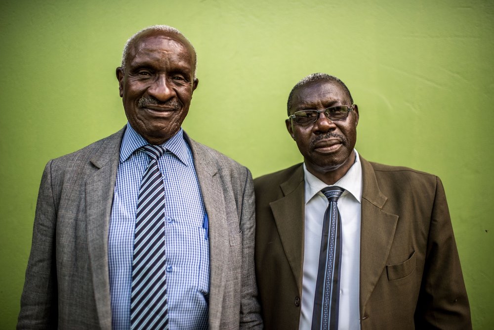  Augustine Egou (l), principal of Soroti Pharmacy School, photographed with a colleague in Soroti town, Uganda. 