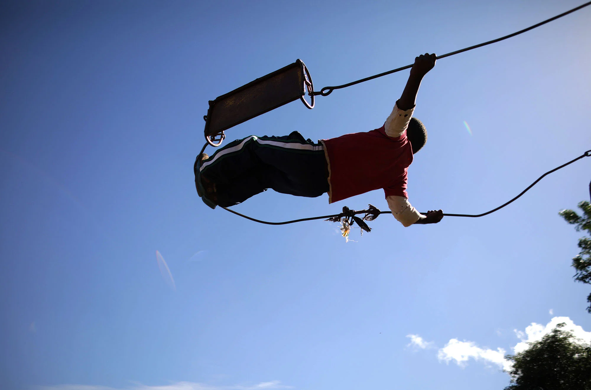  A boy swings at the children's corner. Photo by Josh Estey. 