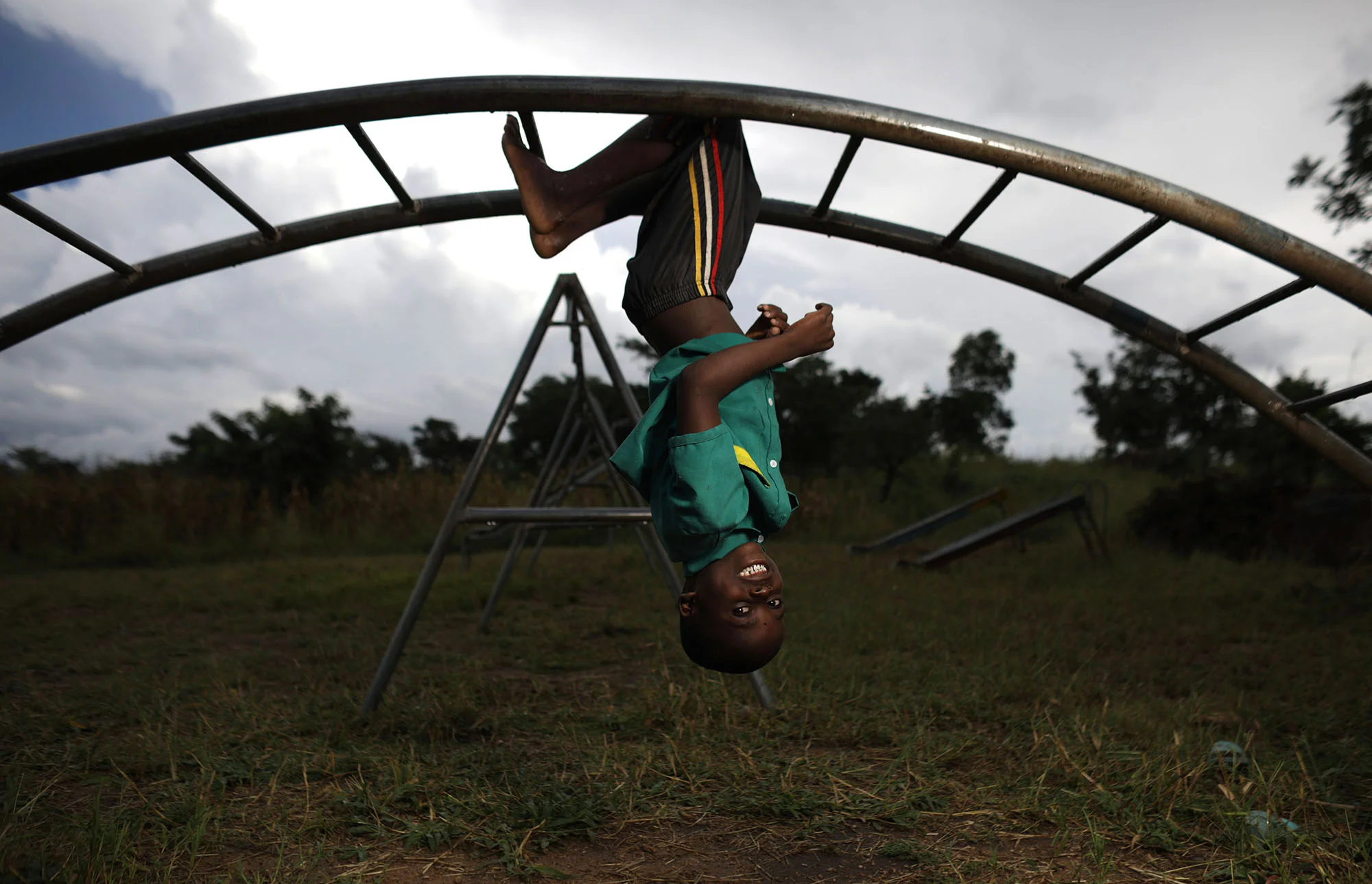  Innocent, 6, plays on the monkey bars.&nbsp;Photo by Josh Estey 