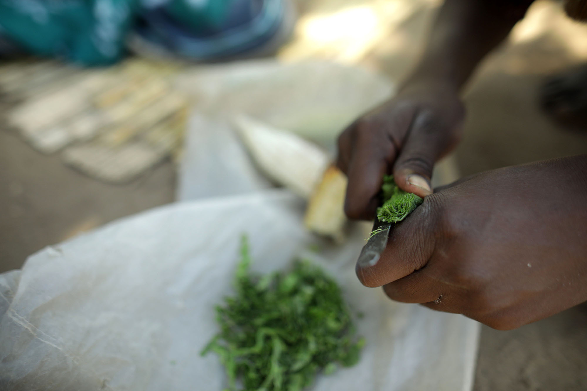  Mariam Chinguwo prepares food.&nbsp;Photo by Josh Estey 