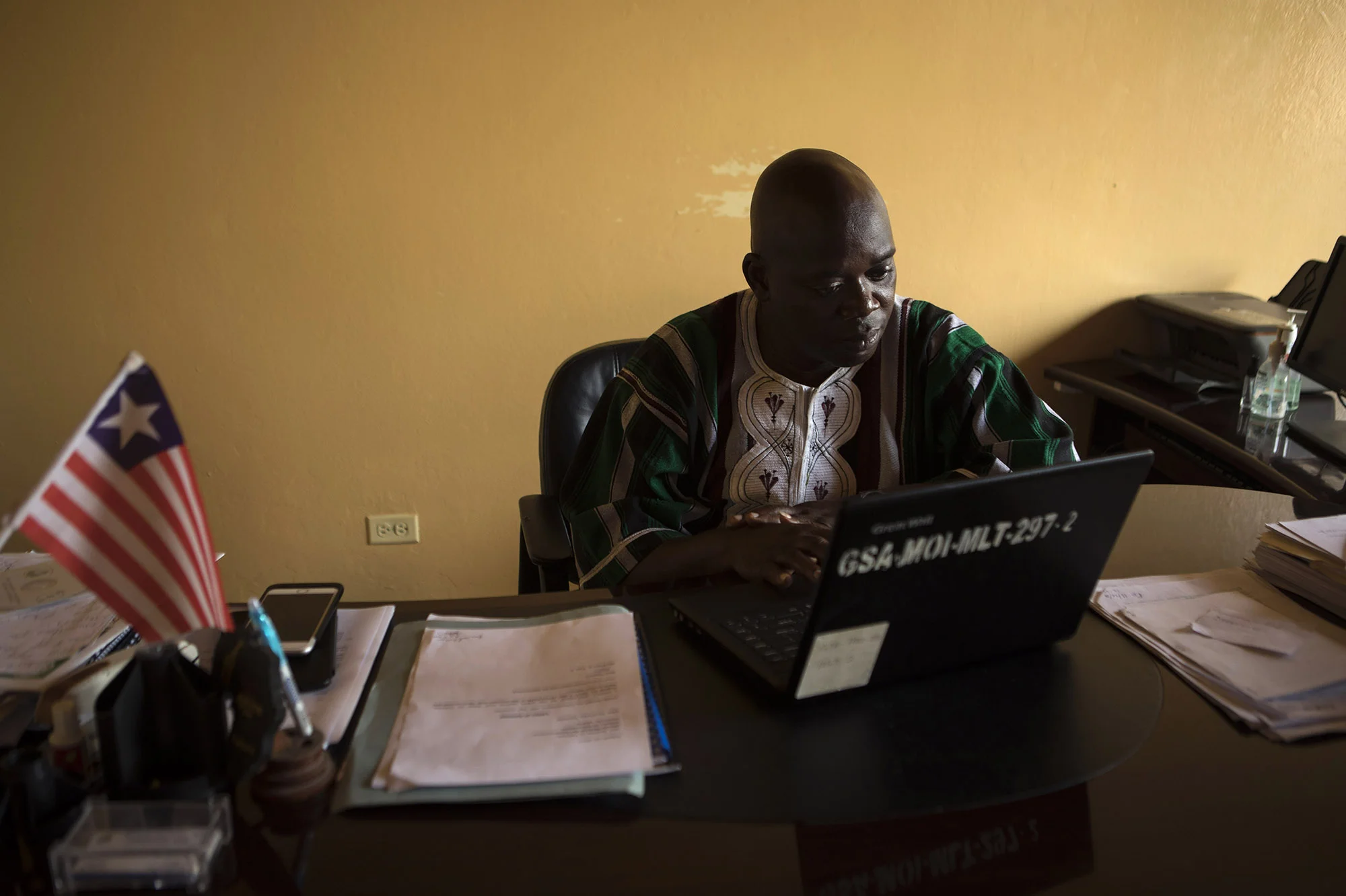  MONROVIA, LIBERIA: Aug. 29, 2017 - Andrew G. Temeh, Deputy Minister of Administration at the Ministry of Information (MICAT) and the OGP Focal Person, works at his desk on Tuesday, Aug. 29. Minister Temeh is working with OGP to create better transpa