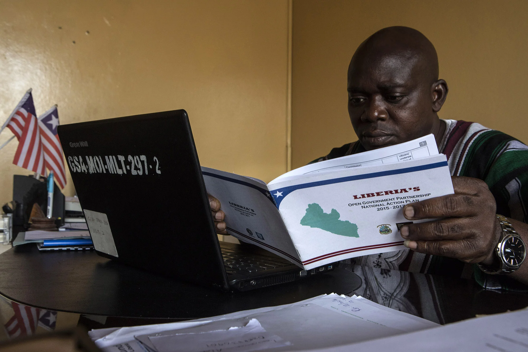 Andrew G. Temeh, Deputy Minister of Administration at the Ministry of Information (MICAT) and the OGP Focal Person, works at his desk on Tuesday, Aug. 29. Minister Temeh is working with OGP to create better transparency and accountability in the government. Liberia joined OGP in 2011.