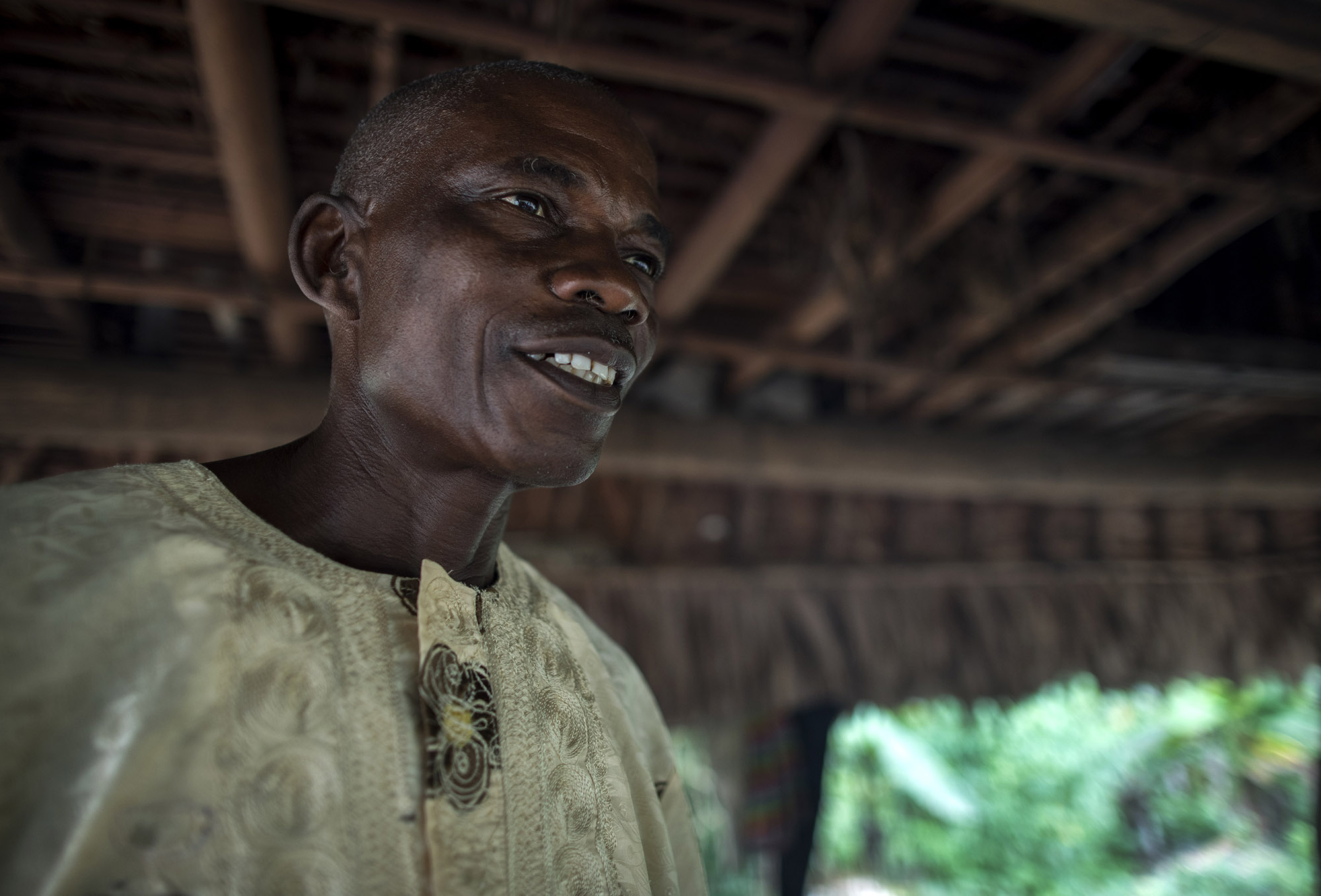  Garmondah Banwon, an elder in the Jogbahn Clan, stands in his kitchen in Blayah Town. The Jogbahn Clan fought against the British-owned company Equatorial Palm Oil (EPO) when they tried to take over their land in 2013. The people in the community de